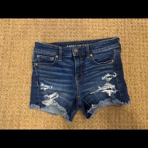 american eagle blue jean shorts with rips